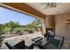 Charming outdoor patio with fireplace and golf course view, perfect for relaxation and outdoor dining at 7780 E Golden Eagle Cir, Gold Canyon, AZ 85118