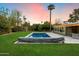 A stunning backyard features a pool, patio, shed and beautiful sunset at 7813 N 17Th Dr, Phoenix, AZ 85021