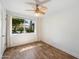Bright bedroom with wood-look floors, a large window, and neutral decor at 7813 N 17Th Dr, Phoenix, AZ 85021