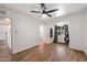 This bedroom features neutral walls, wood floors and a large window at 7813 N 17Th Dr, Phoenix, AZ 85021