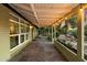 Side covered porch with slate tile flooring and decorative hanging lights at 7813 N 17Th Dr, Phoenix, AZ 85021