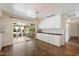 Bright dining room with overhead lighting and white cabinets with a patio view at 7813 N 17Th Dr, Phoenix, AZ 85021