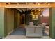 This covered patio features comfortable outdoor seating and string lights at 7813 N 17Th Dr, Phoenix, AZ 85021