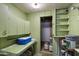 Inside the shed, there are light-green walls, storage shelves and a countertop at 7813 N 17Th Dr, Phoenix, AZ 85021
