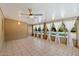 Bright sunroom with tile flooring, ceiling fan, and large windows offering backyard and pool views at 7813 N 17Th Dr, Phoenix, AZ 85021