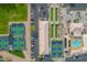 Birds-eye view showcases community bocce ball and tennis courts, parking, pool, and community center at 8037 E Navarro Ave, Mesa, AZ 85209