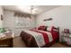 Comfortable bedroom with ceiling fan, bright natural light and neutral walls at 8037 E Navarro Ave, Mesa, AZ 85209