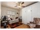Spare bedroom with comfortable seating, built-in Murphy bed, and bright natural light at 8037 E Navarro Ave, Mesa, AZ 85209
