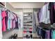 Organized walk-in closet featuring ample hanging space, shelving and room for shoe storage at 8037 E Navarro Ave, Mesa, AZ 85209