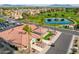 Charming clubhouse set amidst a golf course, boasting scenic views, lush greenery, and a tranquil pond at 8037 E Navarro Ave, Mesa, AZ 85209