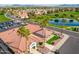 Aerial view of the clubhouse and pond, near the lush golf course and ample parking, perfect for community gatherings at 8037 E Navarro Ave, Mesa, AZ 85209