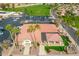 Beautiful clubhouse with a red-tiled roof, palm trees, and ample parking, perfect for community gatherings at 8037 E Navarro Ave, Mesa, AZ 85209
