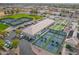 Aerial perspective of recreational amenities including pickleball, bocce ball, and tennis courts available in the community at 8037 E Navarro Ave, Mesa, AZ 85209