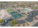 Aerial shot of community center with pool, tennis, pickleball, and bocce ball courts, offering diverse recreation options at 8037 E Navarro Ave, Mesa, AZ 85209