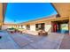 Relaxing courtyard area featuring benches and picnic tables, perfect for outdoor gatherings and refreshments at 8037 E Navarro Ave, Mesa, AZ 85209