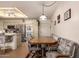 Casual dining area featuring stainless steel appliances, tiled countertops, and seating for four at 8037 E Navarro Ave, Mesa, AZ 85209