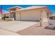 Well-maintained property with spacious driveway and garage, showcasing curb appeal at 8037 E Navarro Ave, Mesa, AZ 85209