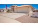 A well-maintained property featuring a spacious driveway and two car garage at 8037 E Navarro Ave, Mesa, AZ 85209