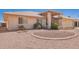 Charming home with desert landscaping, circular brick accents, and a well-maintained exterior at 8037 E Navarro Ave, Mesa, AZ 85209