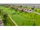 Aerial view of a beautifully designed golf course with lush greenery and a paved cart path at 8037 E Navarro Ave, Mesa, AZ 85209