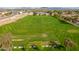 Expansive lush green golf course with meticulously maintained fairways and greens, surrounded by a peaceful community at 8037 E Navarro Ave, Mesa, AZ 85209