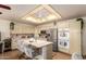 Bright kitchen with island, stainless steel appliances, and abundant cabinet space for storage at 8037 E Navarro Ave, Mesa, AZ 85209