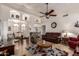 Spacious living room featuring vaulted ceilings, neutral tile flooring, and ample natural light at 8037 E Navarro Ave, Mesa, AZ 85209