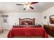 Comfortable main bedroom with ceiling fan, and coordinated decor at 8037 E Navarro Ave, Mesa, AZ 85209