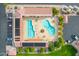 Aerial view of a community pool area with lounge chairs, tables, and landscaping at 8037 E Navarro Ave, Mesa, AZ 85209