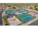 Aerial view of community tennis courts and surrounding residential neighborhood at 8037 E Navarro Ave, Mesa, AZ 85209
