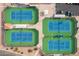 Aerial view shows a well-maintained tennis court with green and blue surfaces for recreational play at 8037 E Navarro Ave, Mesa, AZ 85209