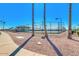 Scenic view of community tennis courts surrounded by desert landscaping and palm trees at 8037 E Navarro Ave, Mesa, AZ 85209