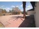 Backyard includes brick paved area, gravel, trees, and block wall at 8310 N 49Th Ave, Glendale, AZ 85302