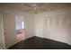 Bedroom with hardwood floors, a fan, and closet storage at 8310 N 49Th Ave, Glendale, AZ 85302