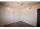 Bedroom includes a fan, large closet, and carpeted floors at 8310 N 49Th Ave, Glendale, AZ 85302