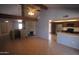 Bright living room with hardwood flooring, fireplace, and open to the kitchen at 8310 N 49Th Ave, Glendale, AZ 85302