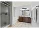 Spacious bathroom with dual vanity, a shower, and large soaking tub at 8335 W Pershing Ave, Peoria, AZ 85381