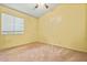 Spacious bedroom featuring ample natural light and neutral carpet flooring at 8335 W Pershing Ave, Peoria, AZ 85381