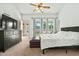 Bedroom with access to patio, ceiling fan, and large dresser at 8335 W Pershing Ave, Peoria, AZ 85381