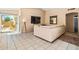 Bright living room with a sliding glass door that leads to a covered patio at 8335 W Pershing Ave, Peoria, AZ 85381