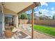 Cozy covered patio area with stylish porch swing and comfortable wicker furniture at 8335 W Pershing Ave, Peoria, AZ 85381