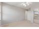 Bedroom with neutral carpet, a ceiling fan, and a large closet with sliding doors at 852 E Mountain View Rd # 18, San Tan Valley, AZ 85143
