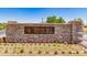 Stone monument sign at Indigo Sky Recreation Center with well-maintained landscaping at 852 E Mountain View Rd # 18, San Tan Valley, AZ 85143