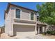 Charming two-story home featuring a well-maintained yard and a two-car garage at 852 E Mountain View Rd # 18, San Tan Valley, AZ 85143