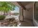Inviting front porch area with decorative railings and potted plants, offering a cozy outdoor space at 852 E Mountain View Rd # 18, San Tan Valley, AZ 85143
