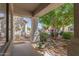 Inviting front porch area with decorative railings and potted plants, offering a cozy outdoor space at 852 E Mountain View Rd # 18, San Tan Valley, AZ 85143