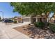 Charming two-story home featuring a well-maintained yard, mature tree, and a two-car garage at 852 E Mountain View Rd # 18, San Tan Valley, AZ 85143