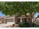 Charming two-story home featuring a well-maintained yard, mature tree, and a two-car garage at 852 E Mountain View Rd # 18, San Tan Valley, AZ 85143