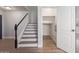 Hallway with staircase, under-stair closet and wood-look floors at 852 E Mountain View Rd # 18, San Tan Valley, AZ 85143
