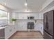 Beautiful kitchen with stainless steel appliances, white cabinets and lots of counter space at 852 E Mountain View Rd # 18, San Tan Valley, AZ 85143